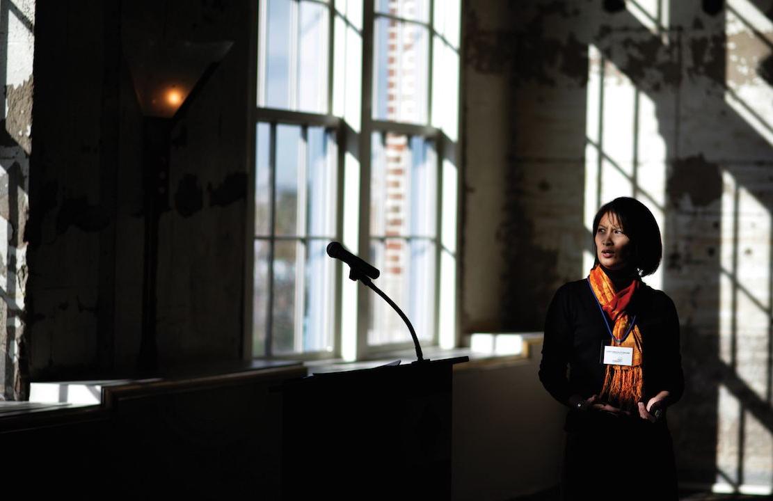 AnnJanette Alejano-Steele giving a speech in the Tivoli