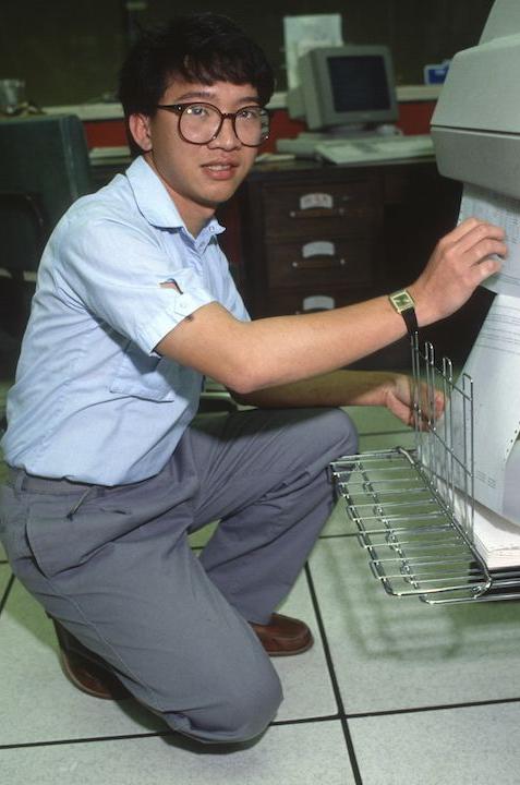 Student attempting to work the dot matrix printer